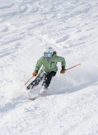 A woman skiing in powder