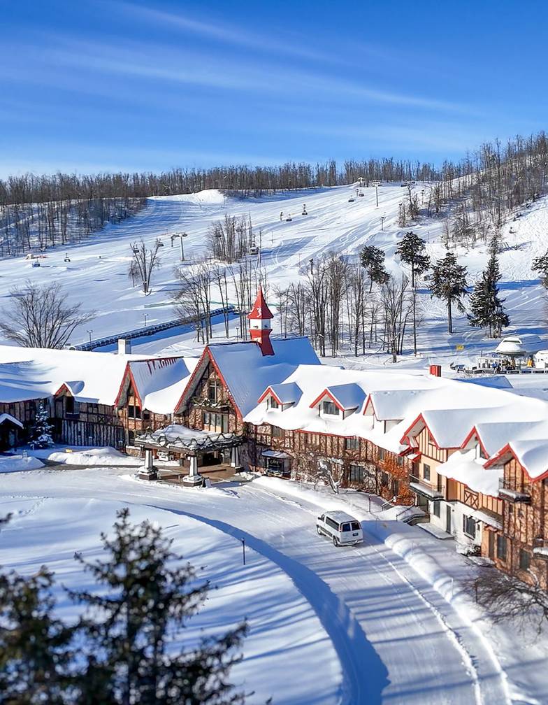 A drone shot of The Highlands Main Lodge in winter