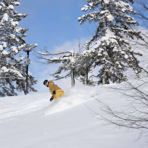 A snowboarder at The Highlands