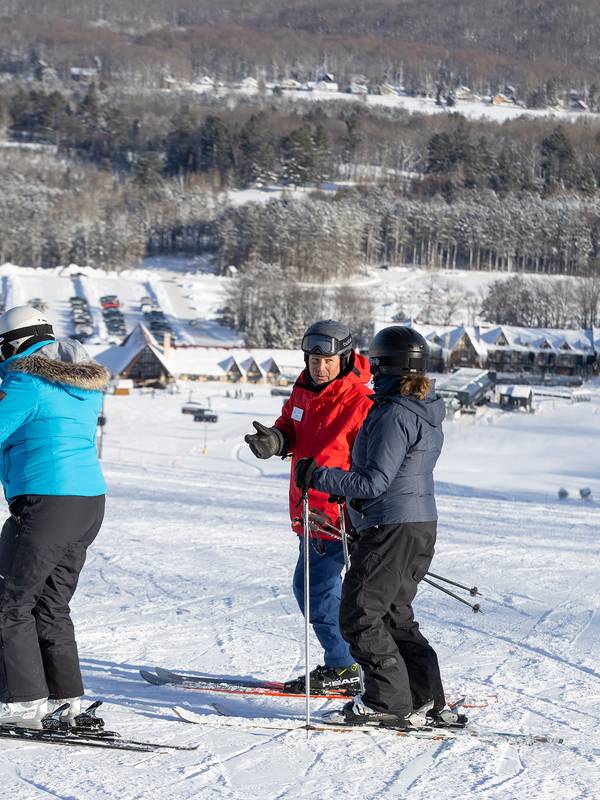 A group of skiers taking a lesson at The Highlands
