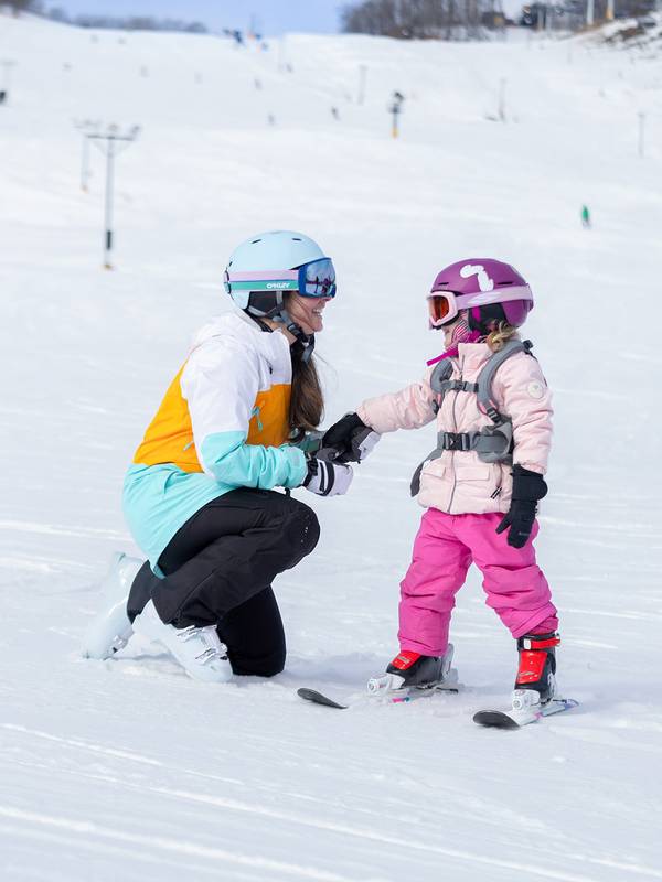 Mom and child in snow gear
