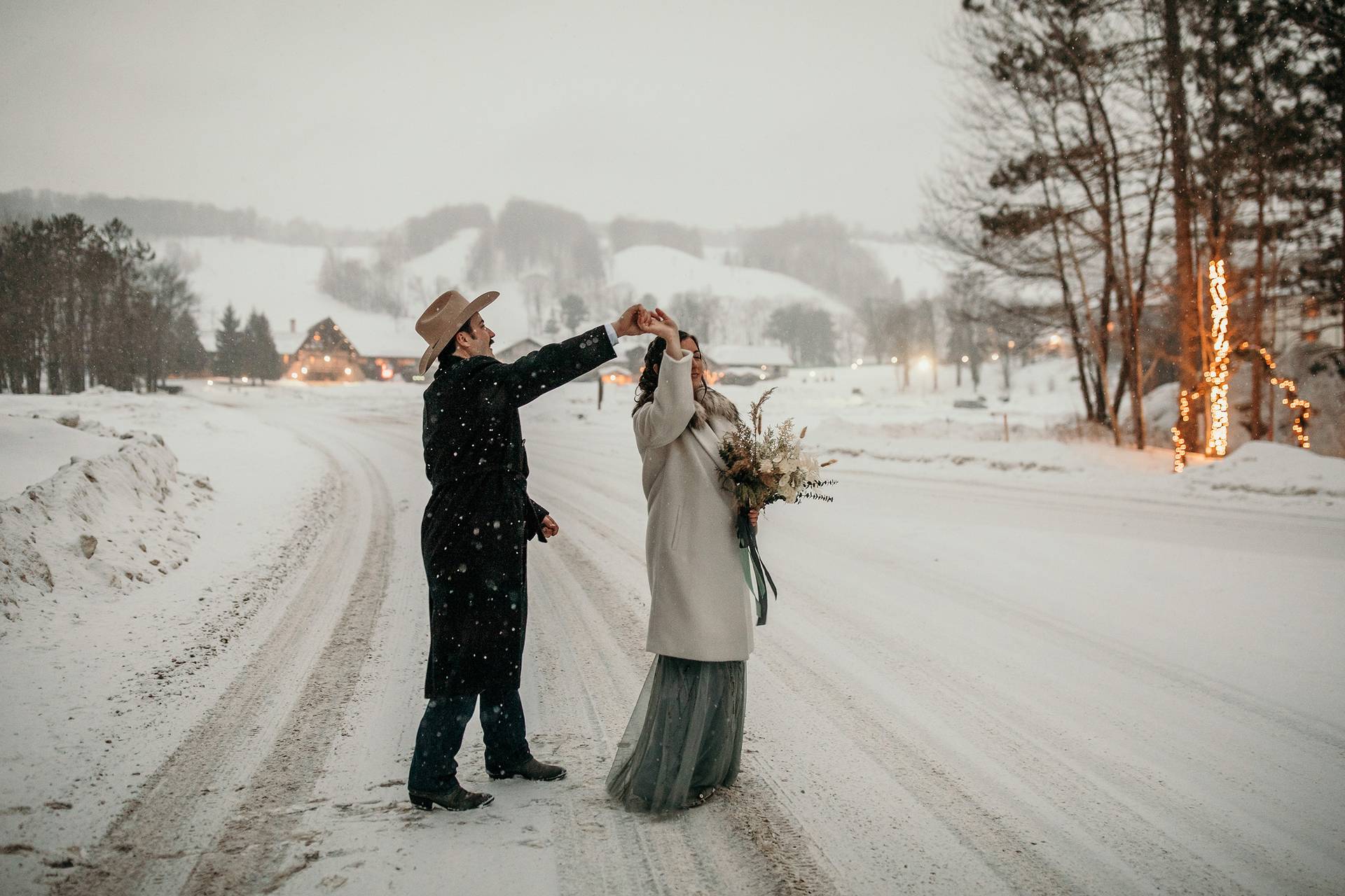 A couple twirling in the snow