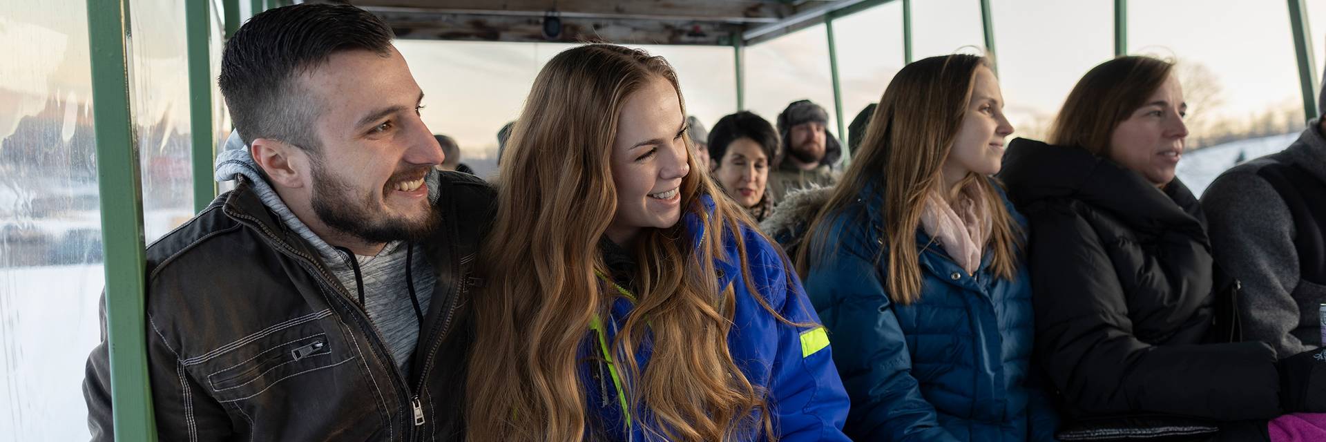A couple smiling while attending the Aonach Mor Moonlight Dinner at The Highlands