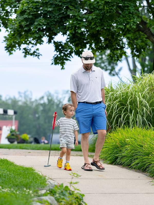 A dad and child walking