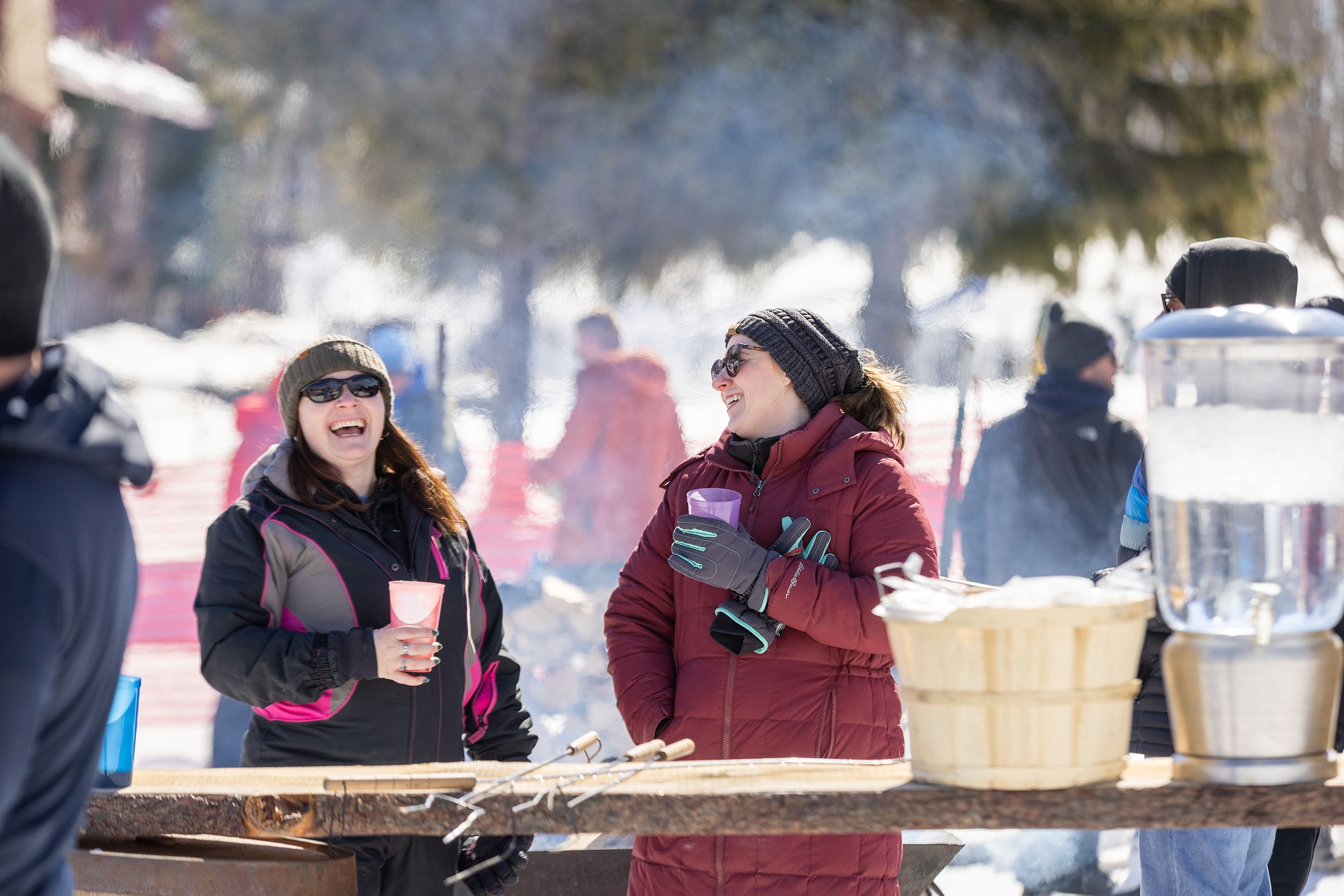Two women smiling at the Hops 'N Highland event