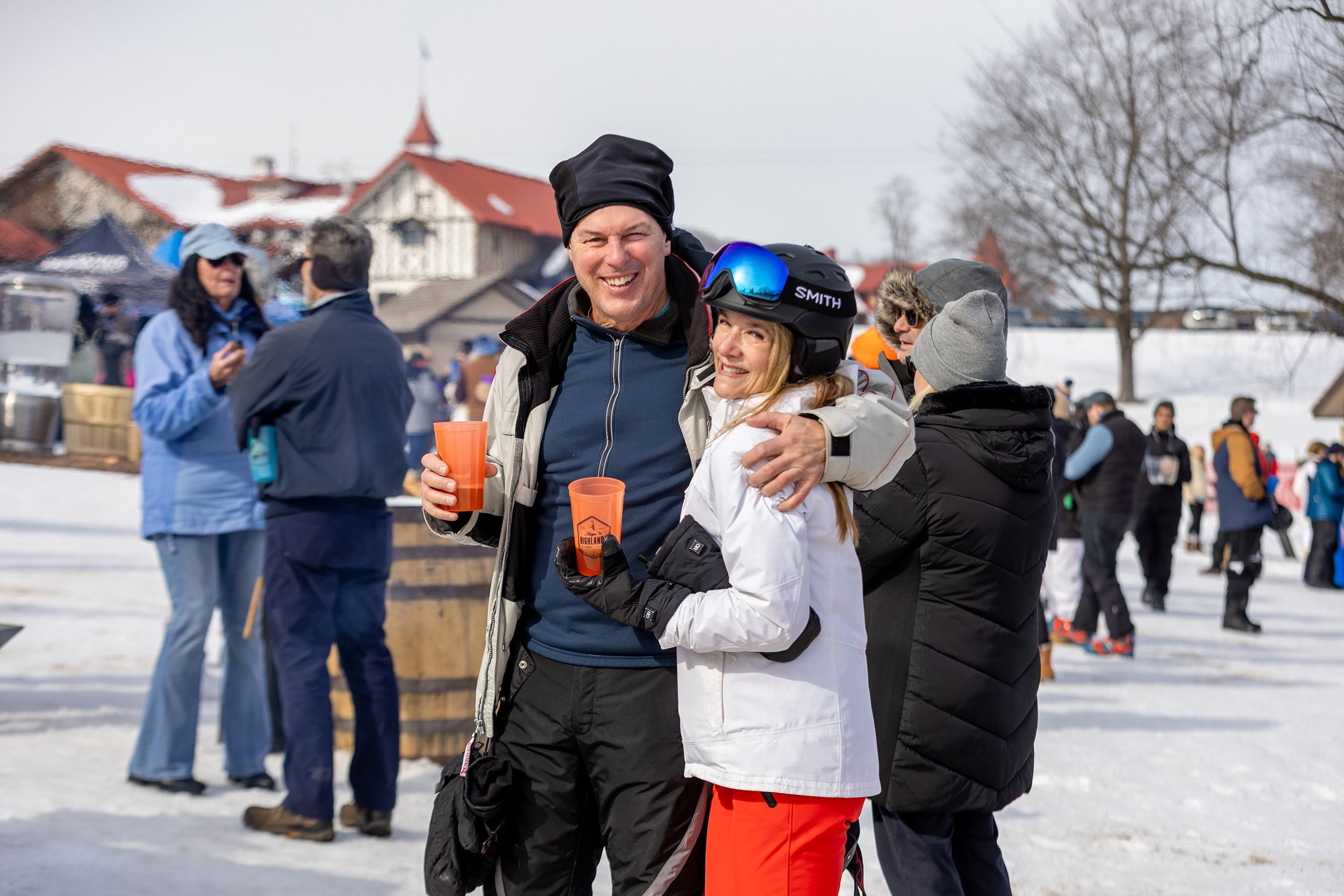 A couple smiling at the Hops 'N Highlands event