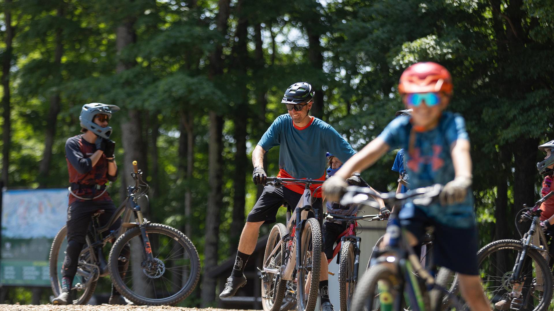 A family of mountain bikers on the top of the hill