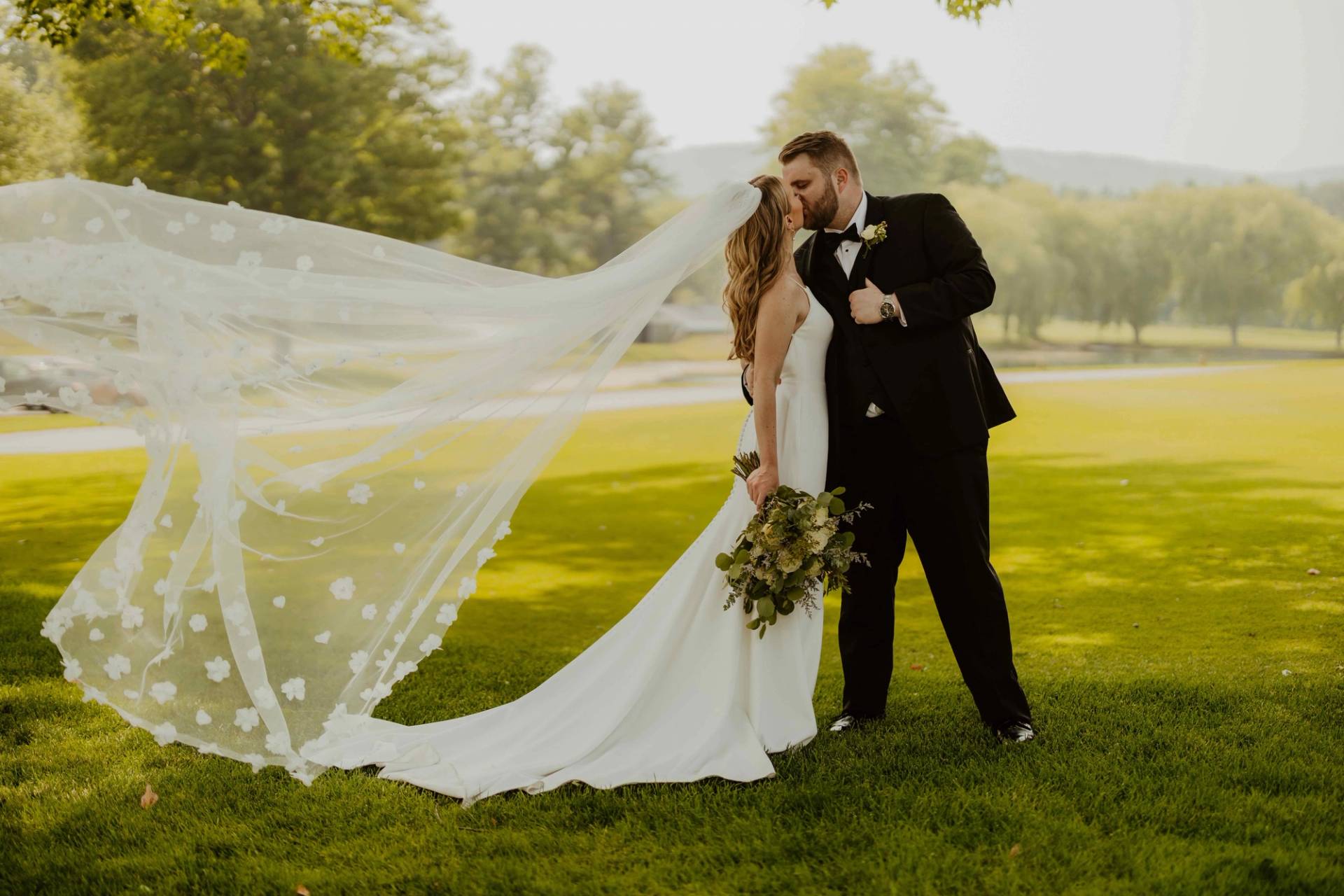 A bride and groom sharing a kiss