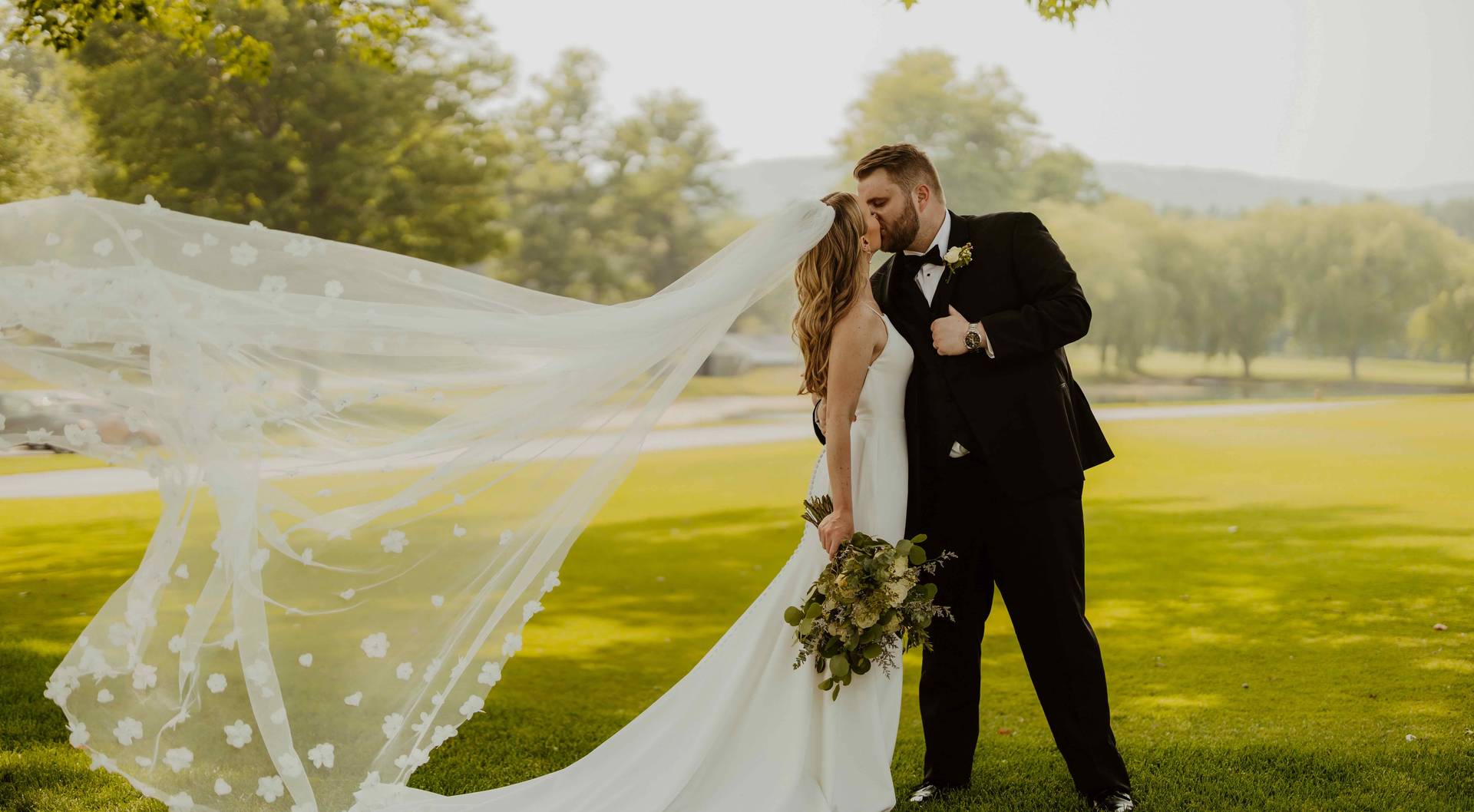 A bride and groom sharing a kiss