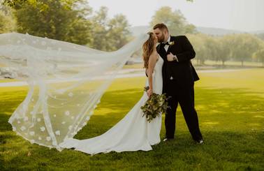 A bride and groom sharing a kiss
