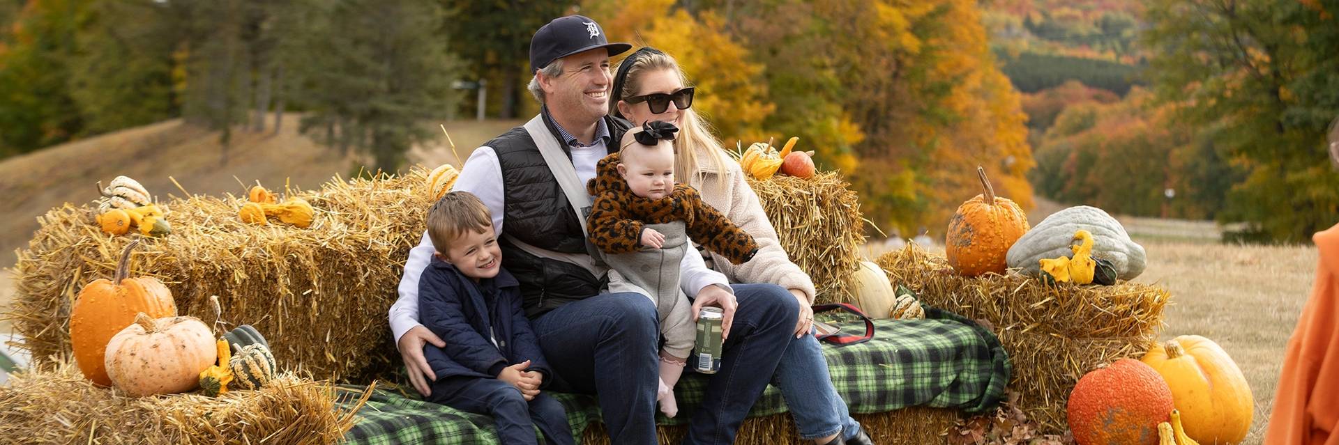 A family posing during The Highlands Harvest Fest Event