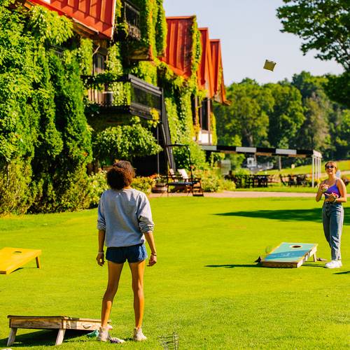 Two women playing yard games at The Highlands