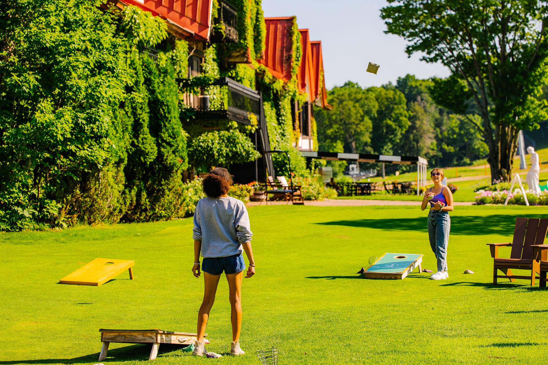 Two women playing yard games at The Highlands