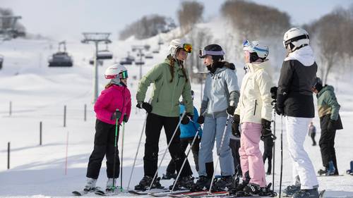 A group of skiers posing