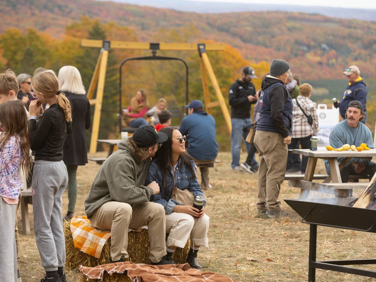 A group of people milling about at The Highlands Harvest Fest