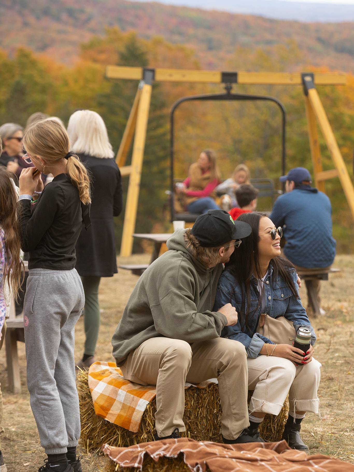 A group of people milling about at The Highlands Harvest Fest