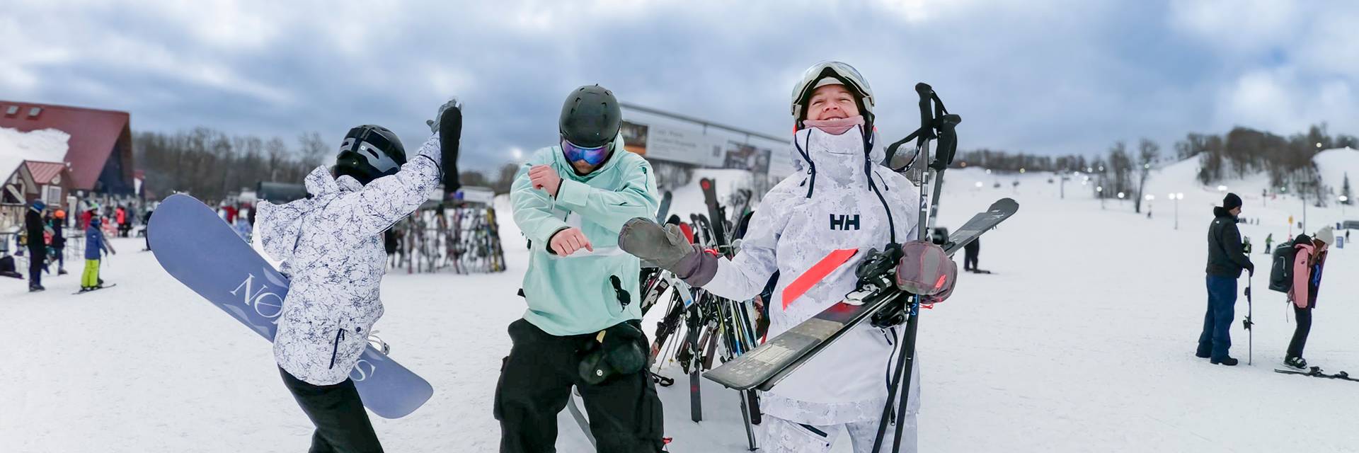 A group of people in ski gear dancing