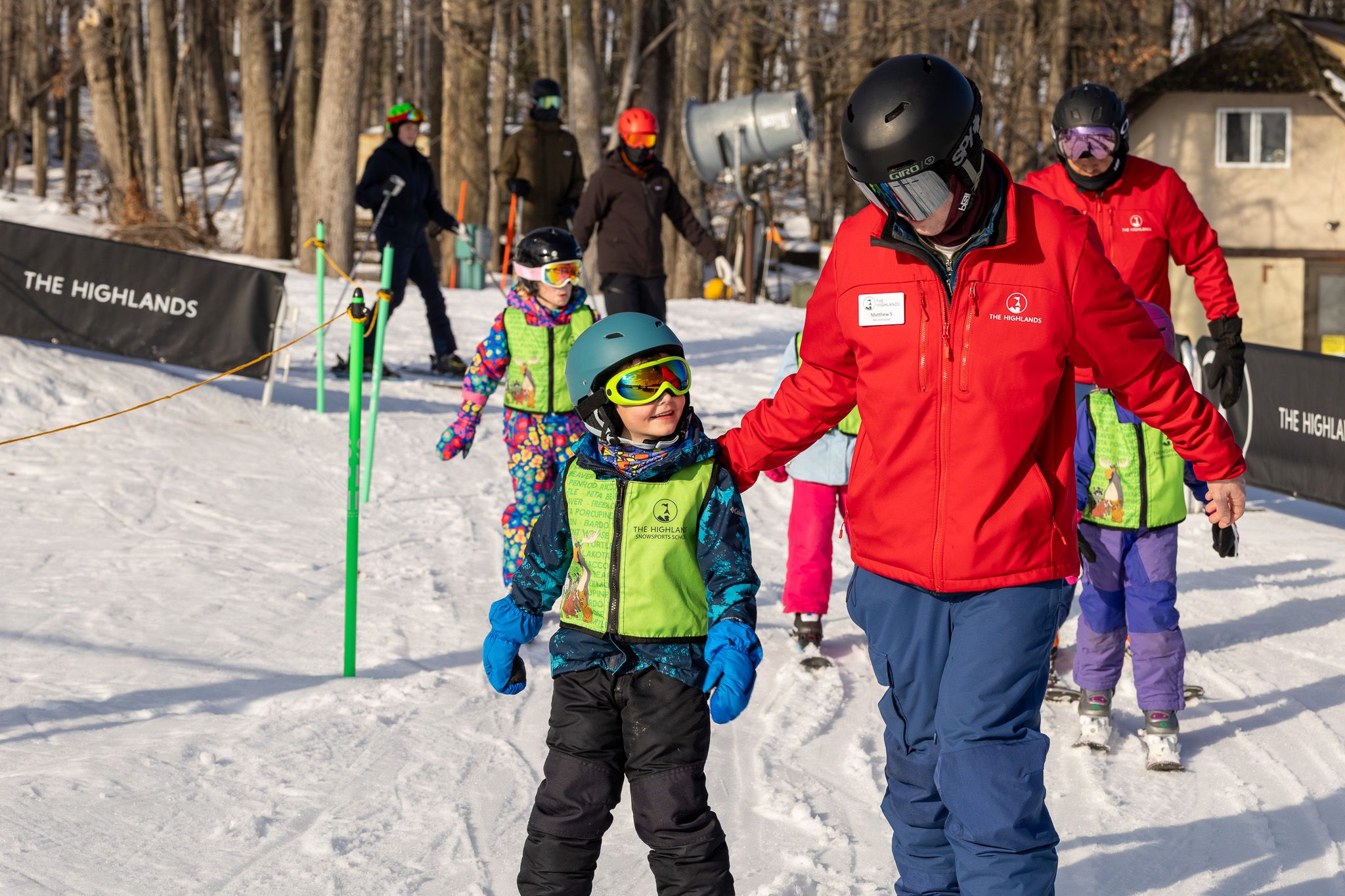 Kids during a ski lesson with their instructor at The Highlands