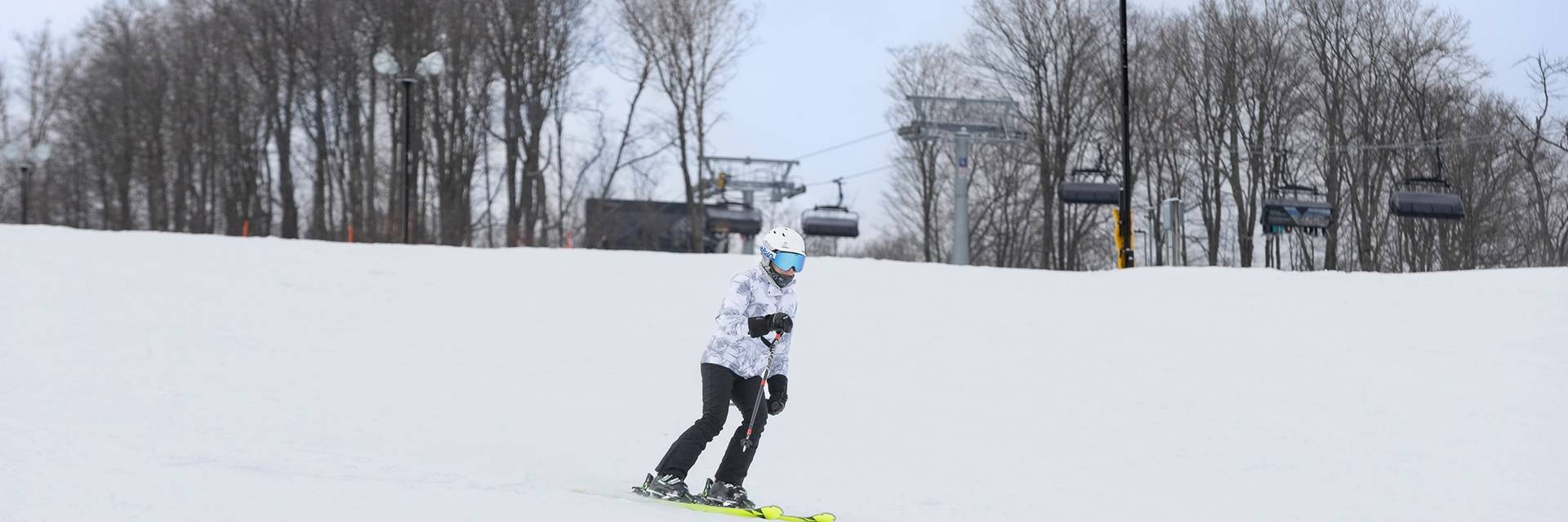 A woman skiing at The Highlands
