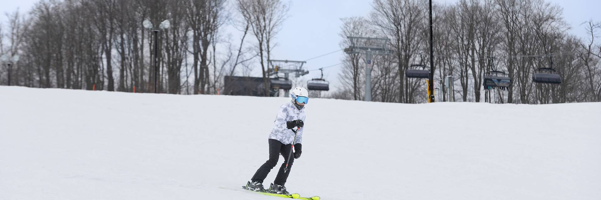 A woman skiing at The Highlands