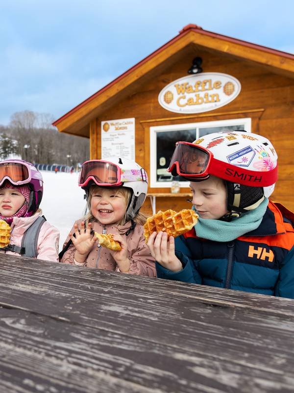 Kids eating waffles at the Waffle Cabin at The Highlands