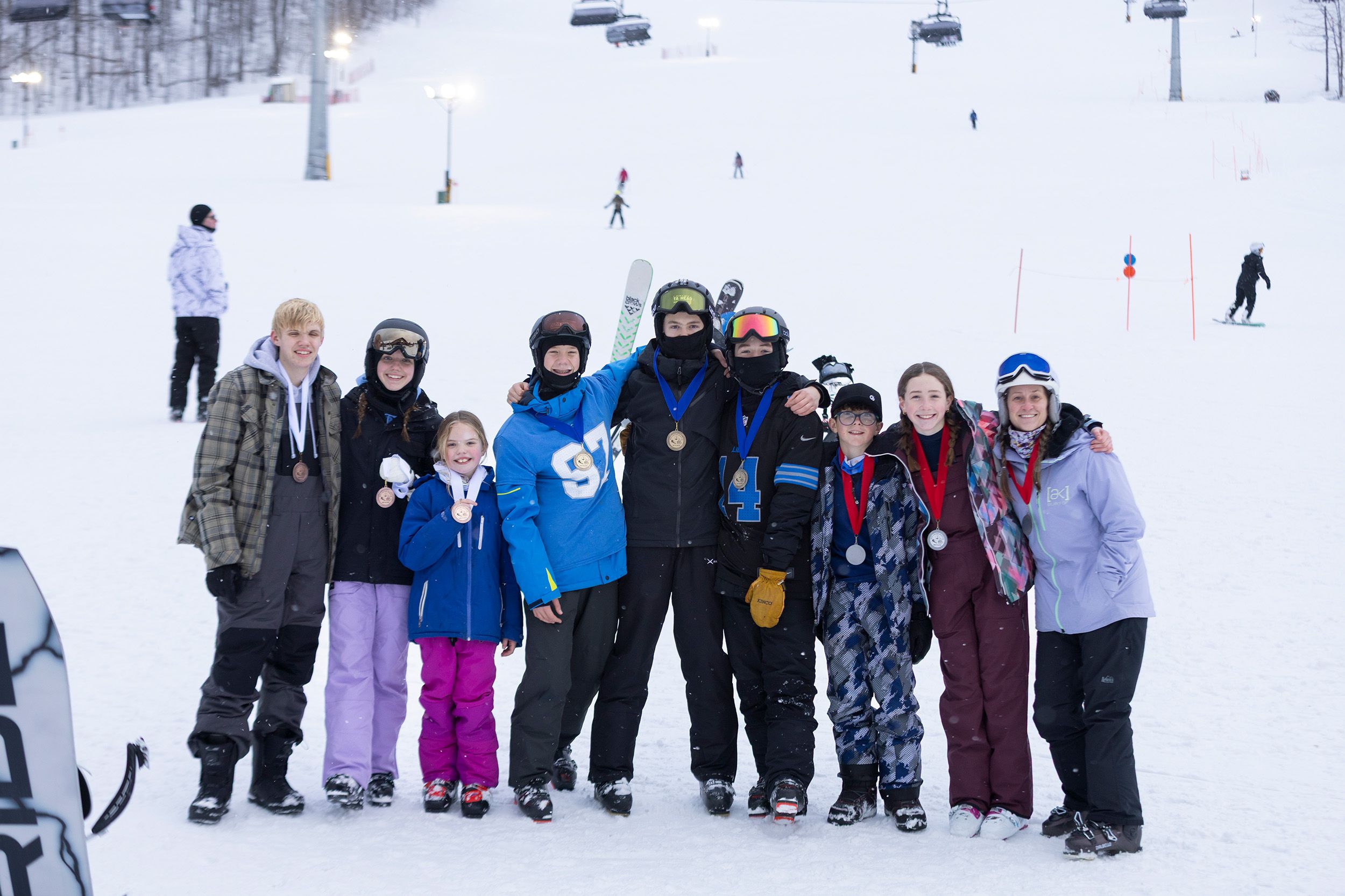 Kids grouped together posing with their awards