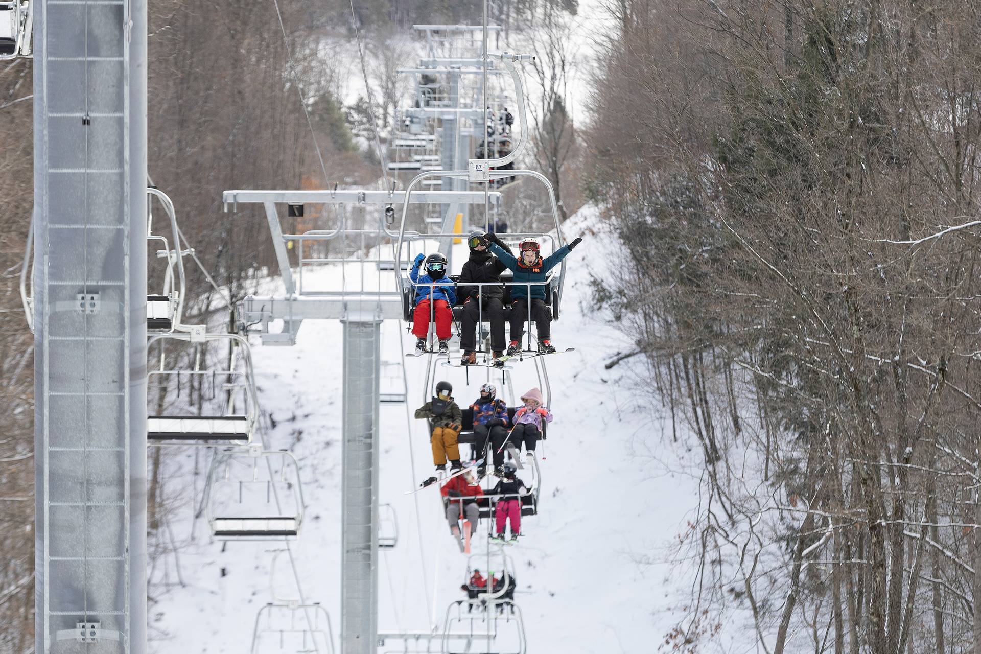 People on the Interconnect Chairlift at The Highlands