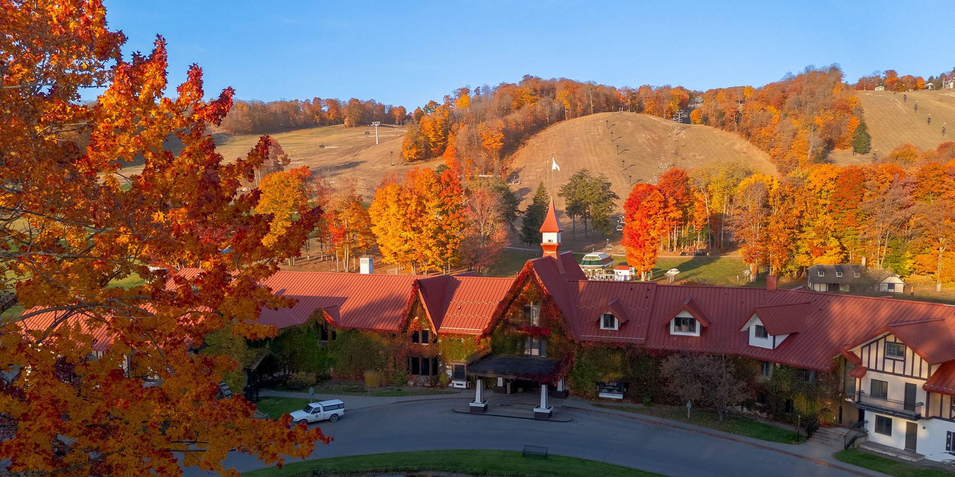 Drone shot of the Main Lodge exterior during fall