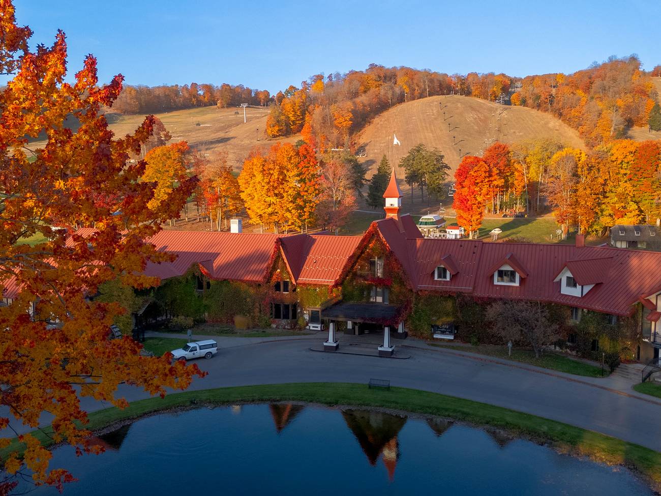 Drone shot of the Main Lodge exterior during fall