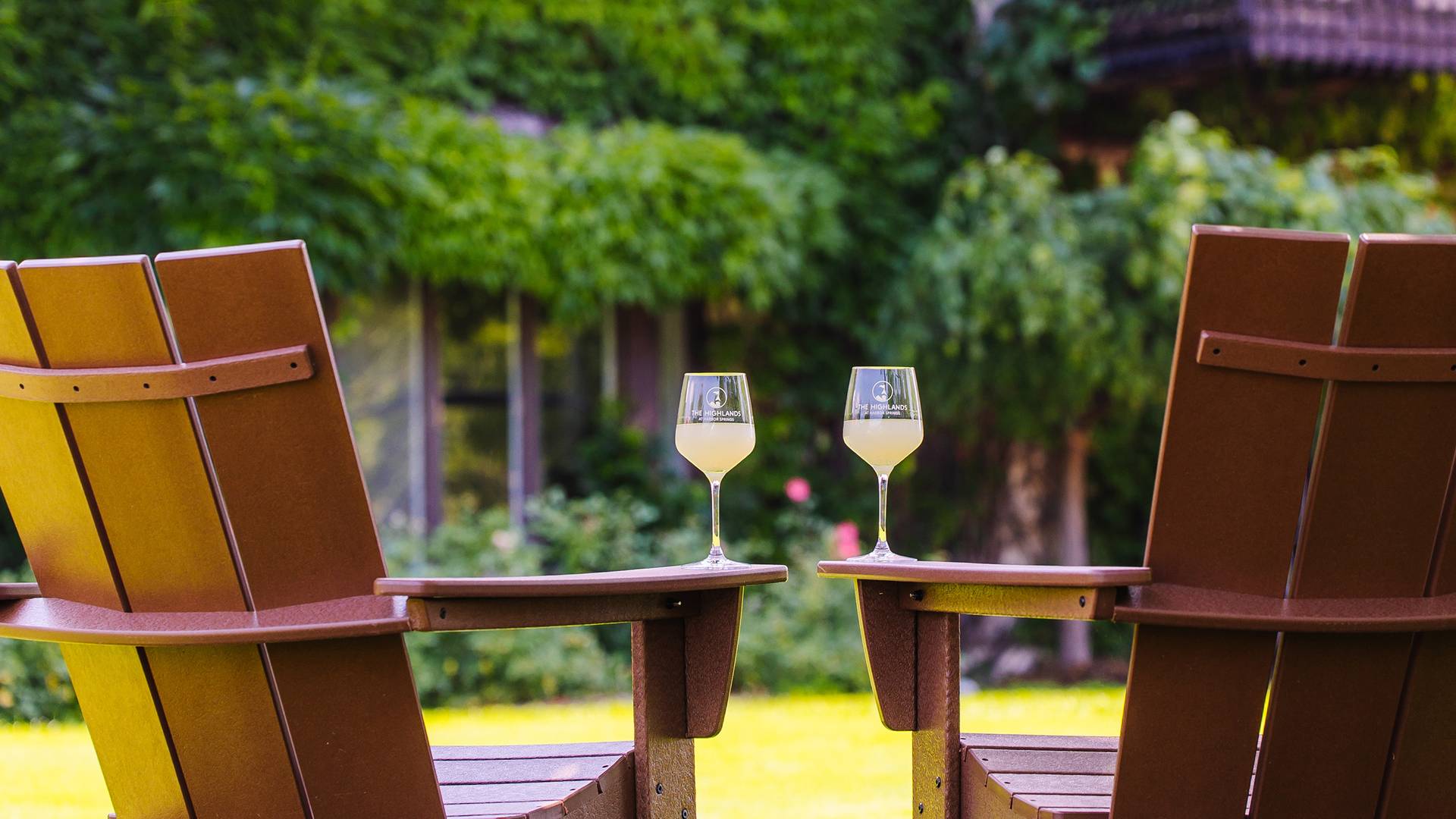 Two chairs and two glasses of wine