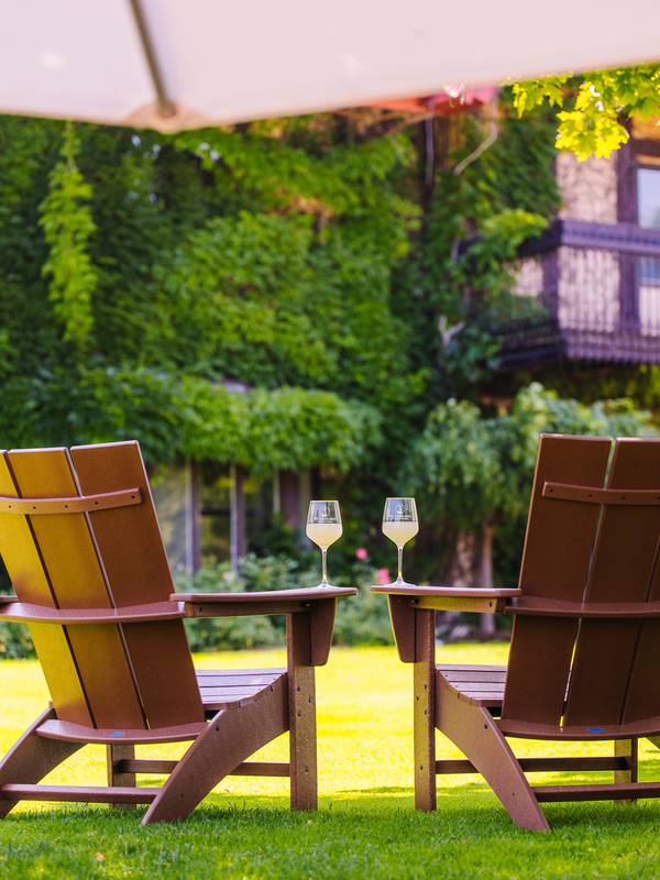 Two chairs and two glasses of wine