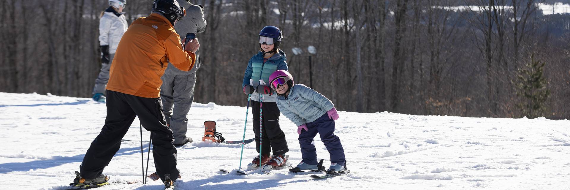 A family posing in ski gear at The Highlands