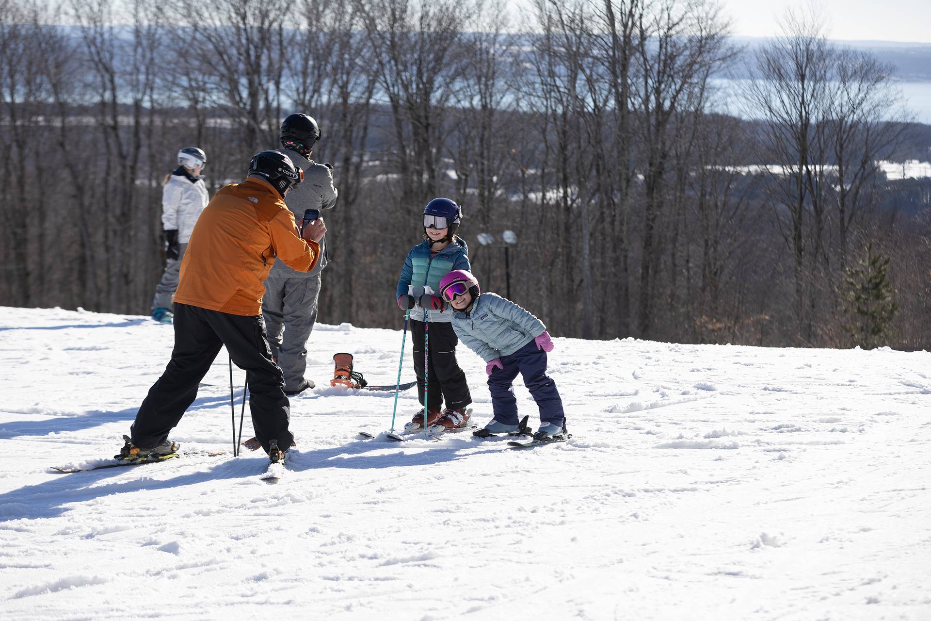 A family posing in ski gear at The Highlands