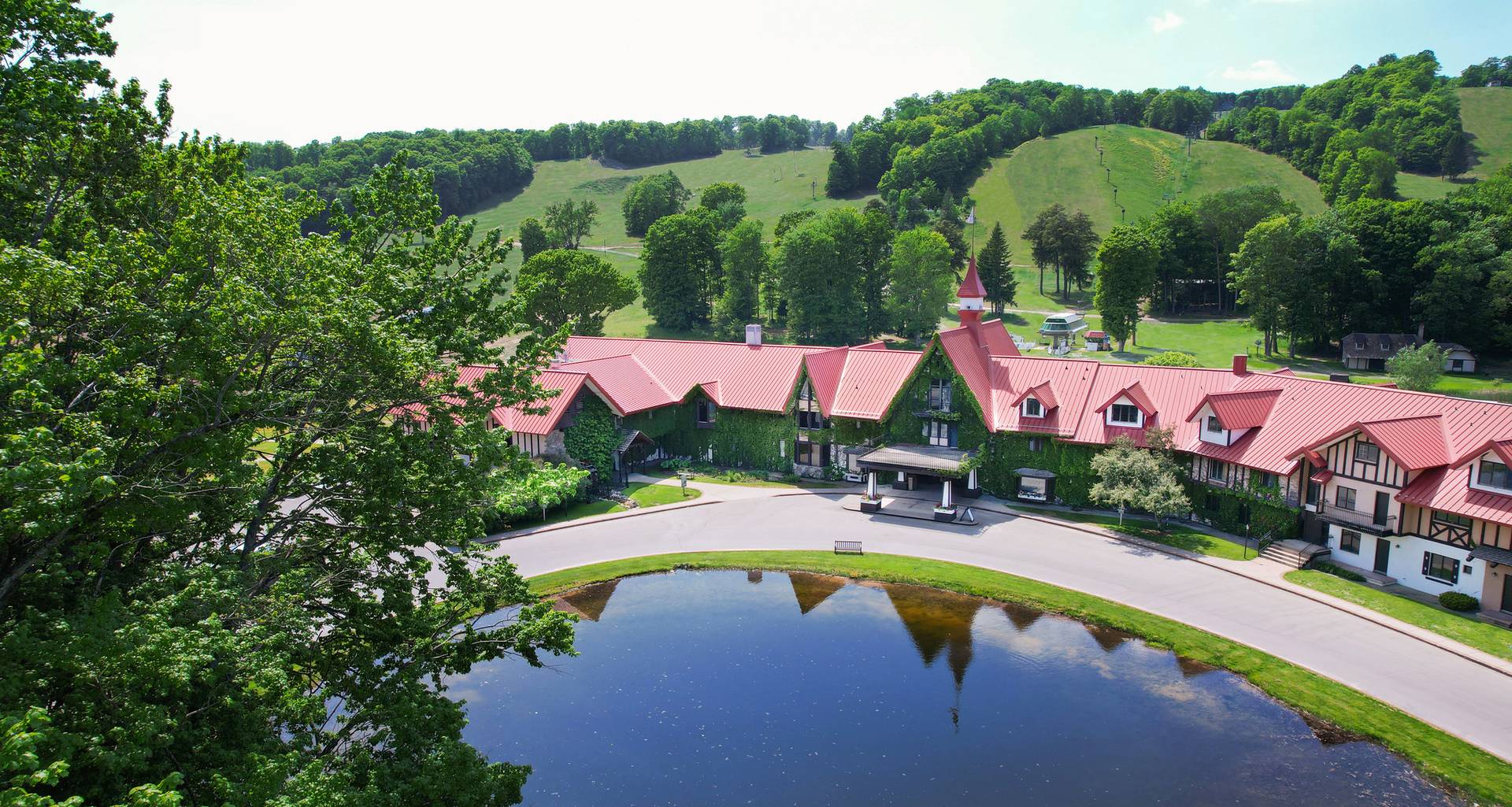 The Highlands Main Lodge exterior in summer drone shot