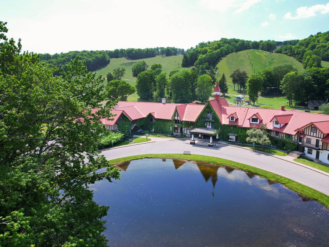 The Highlands Main Lodge exterior in summer drone shot