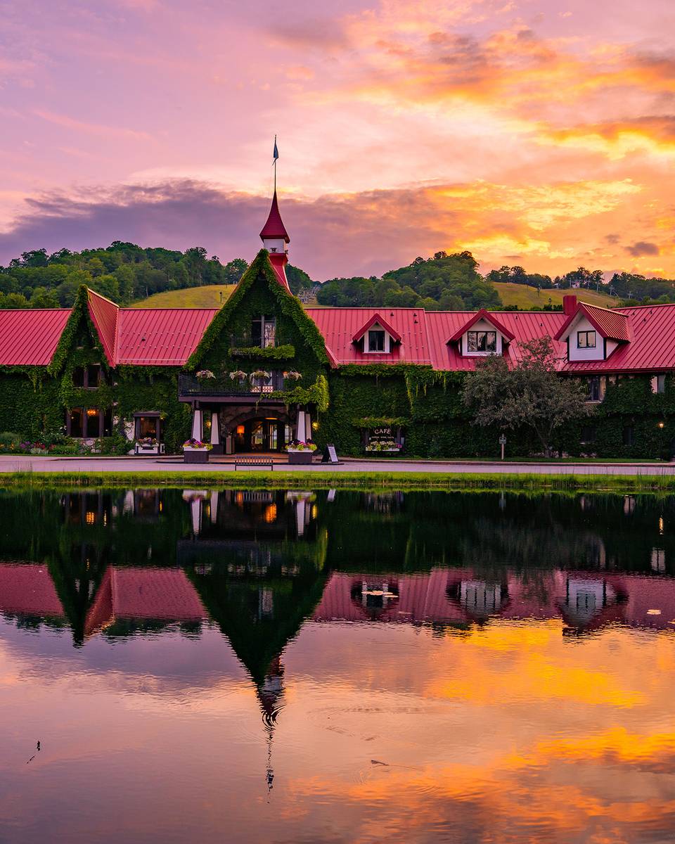 The Main Lodge exterior in summer during a sunset