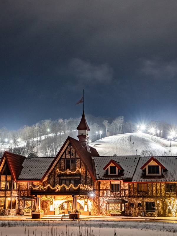 The Highlands Main Lodge in winter at night