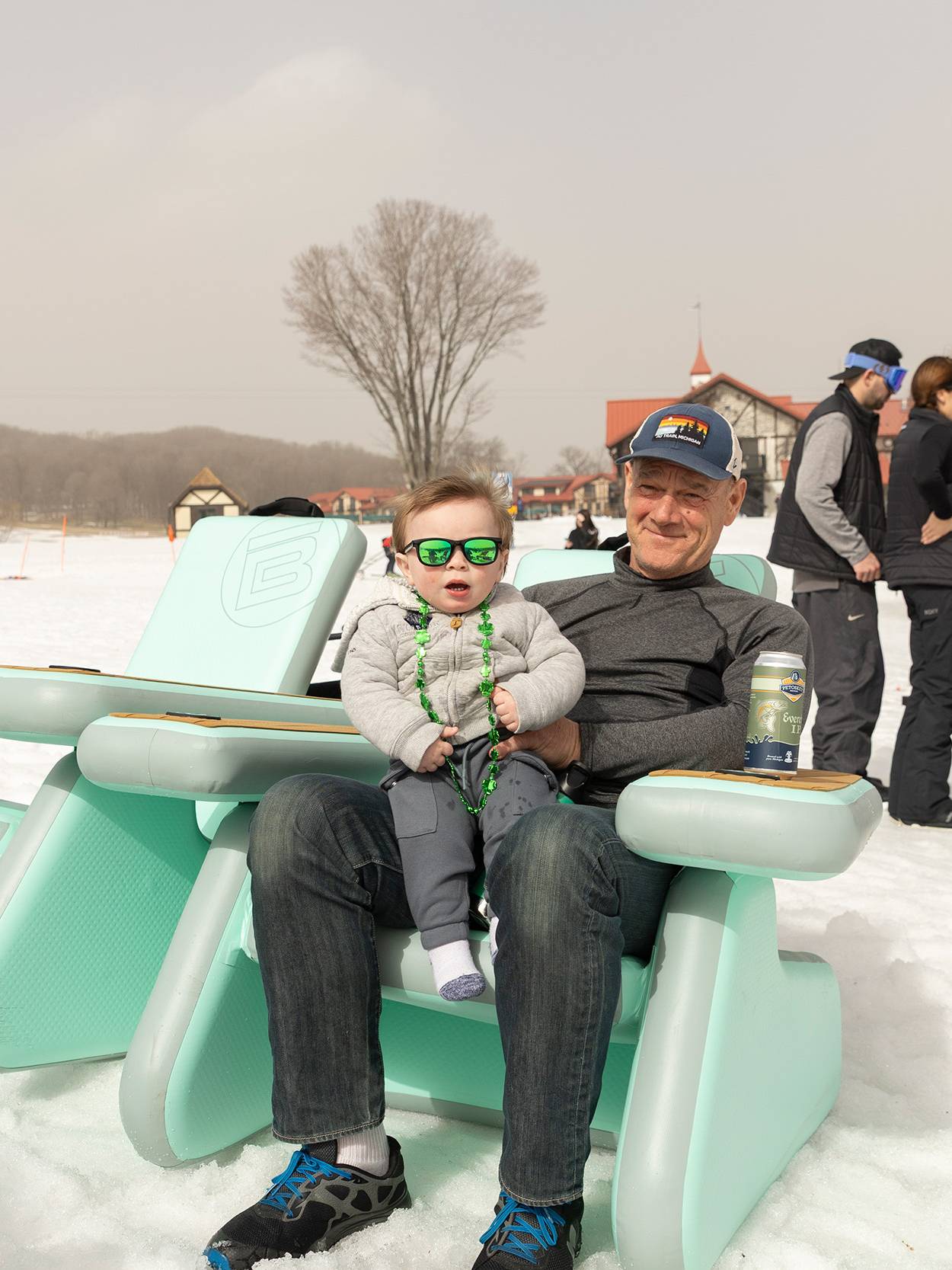 A dad and baby sitting at The Highlands