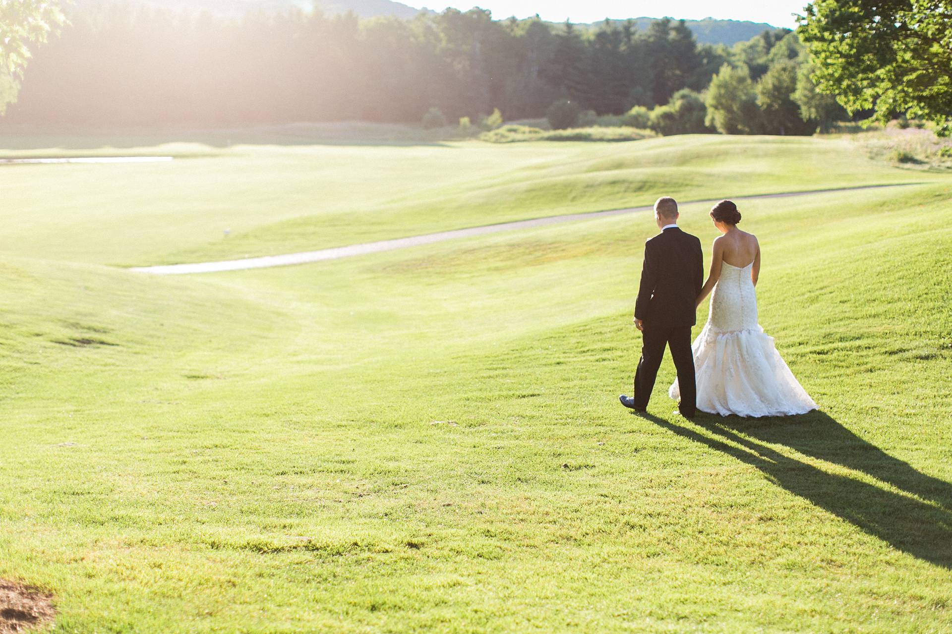 A couple walking on a golf course