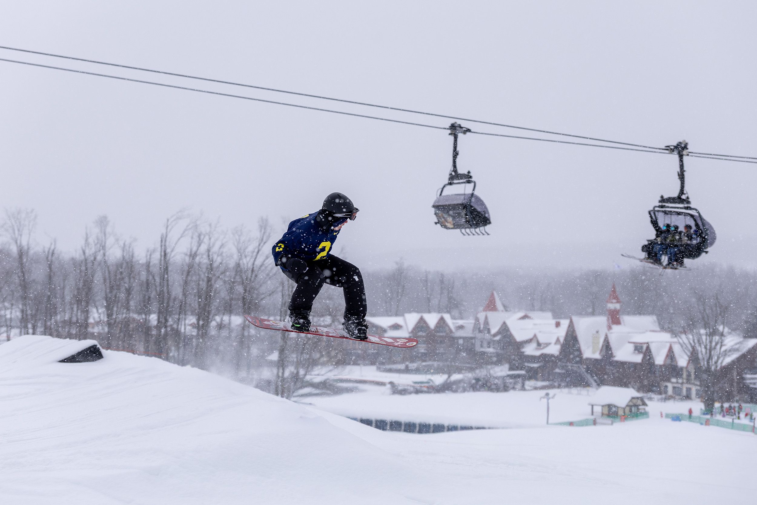 A snowboarder on the Funland Terrain Park at The Highlands