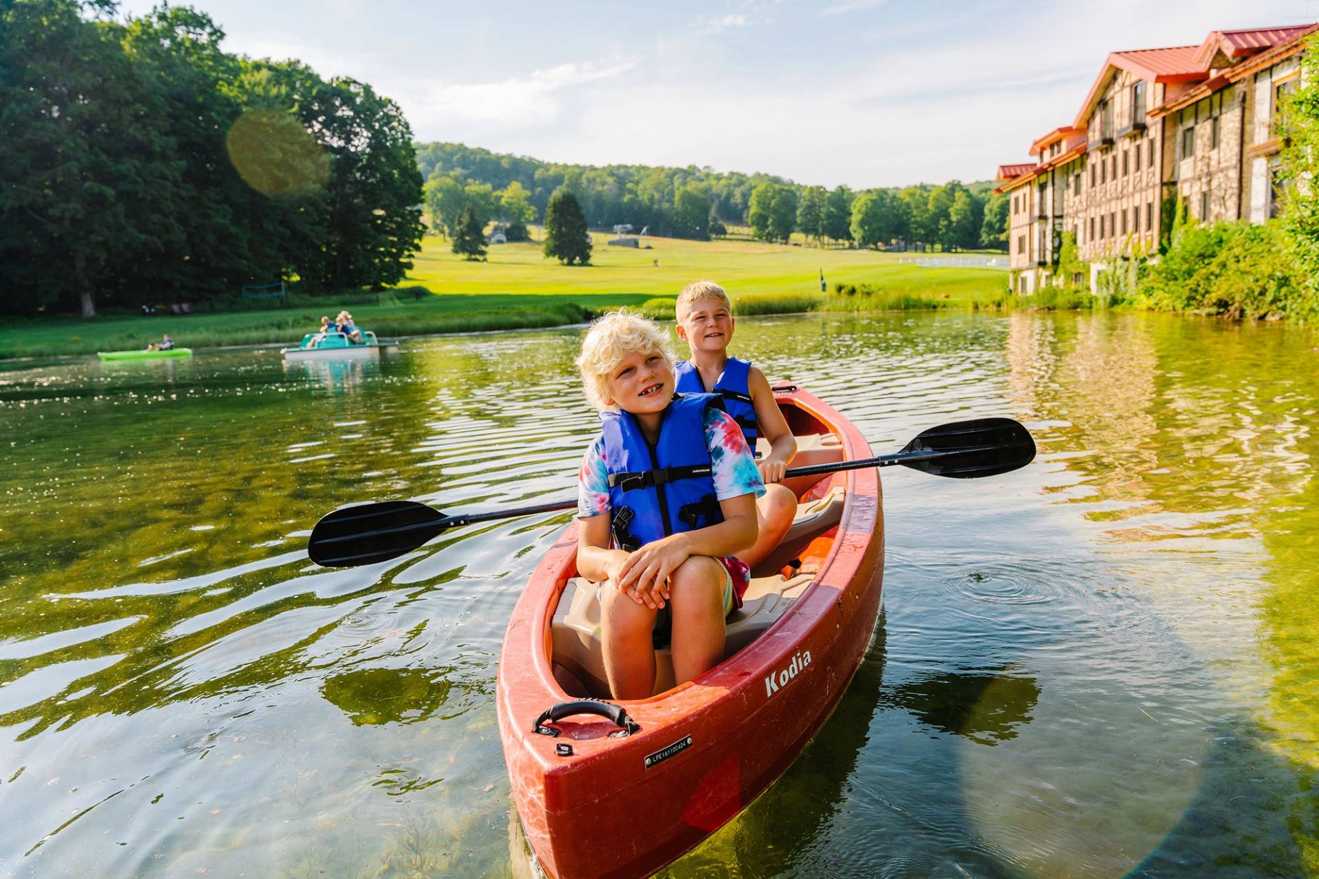 Two kids in a canoe at The Highlands