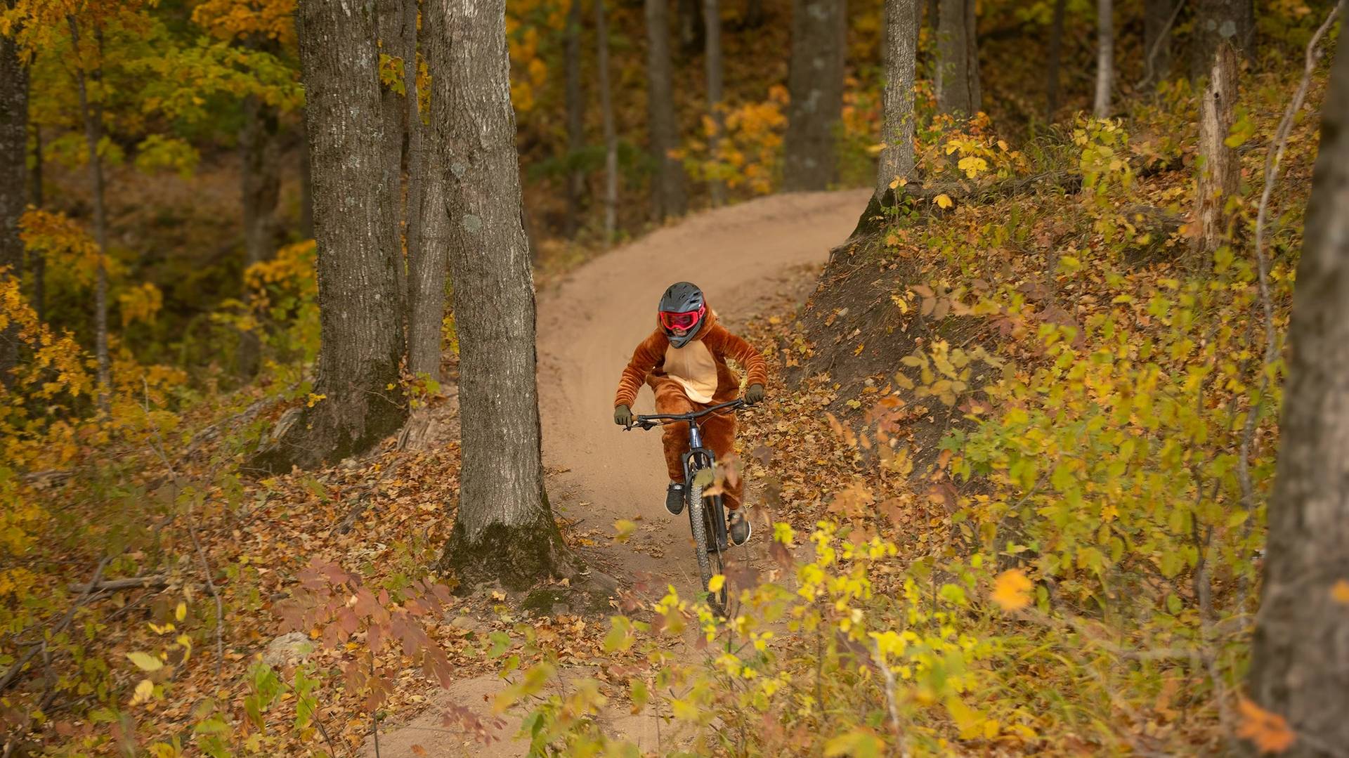 A mountain bikers on the trail in costume