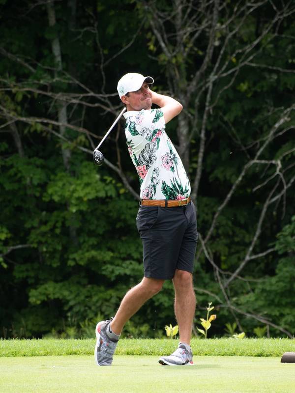 A man golfing