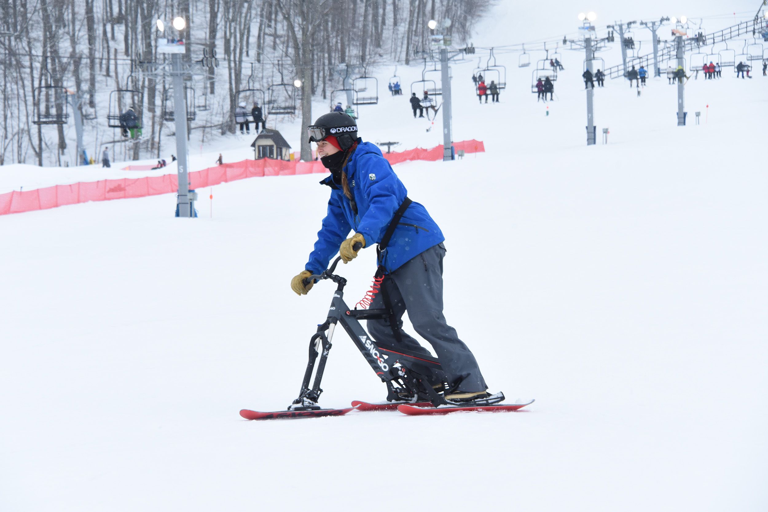 A woman on a Sno-Go Bike at The Highlands