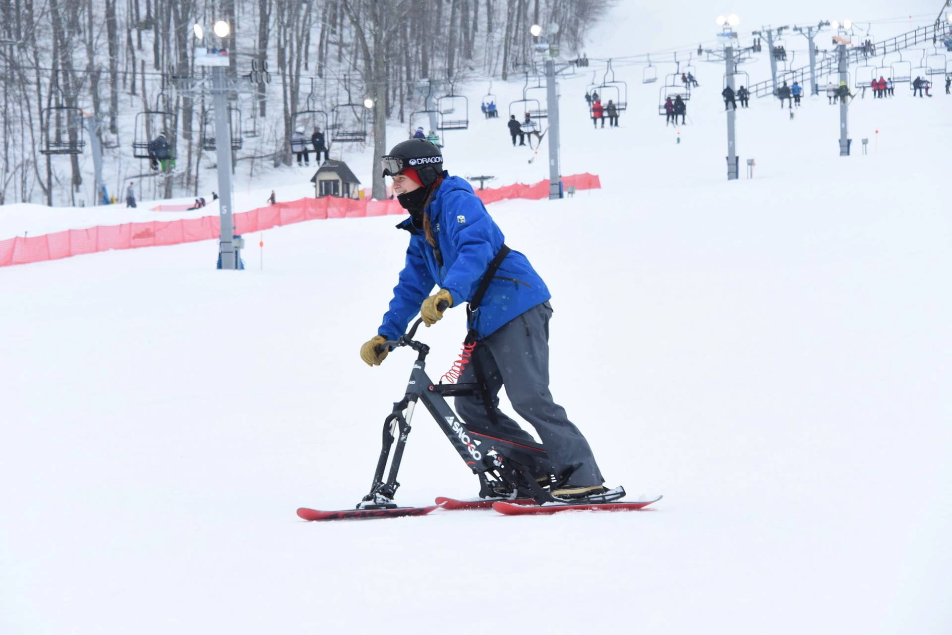 A woman on a SnoGo bike at The Highlands