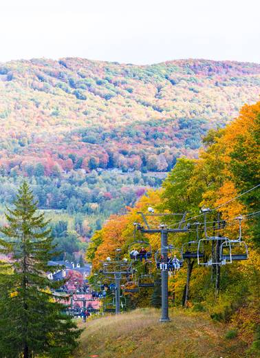 Scenic chairlift riders during fall at The Highlands