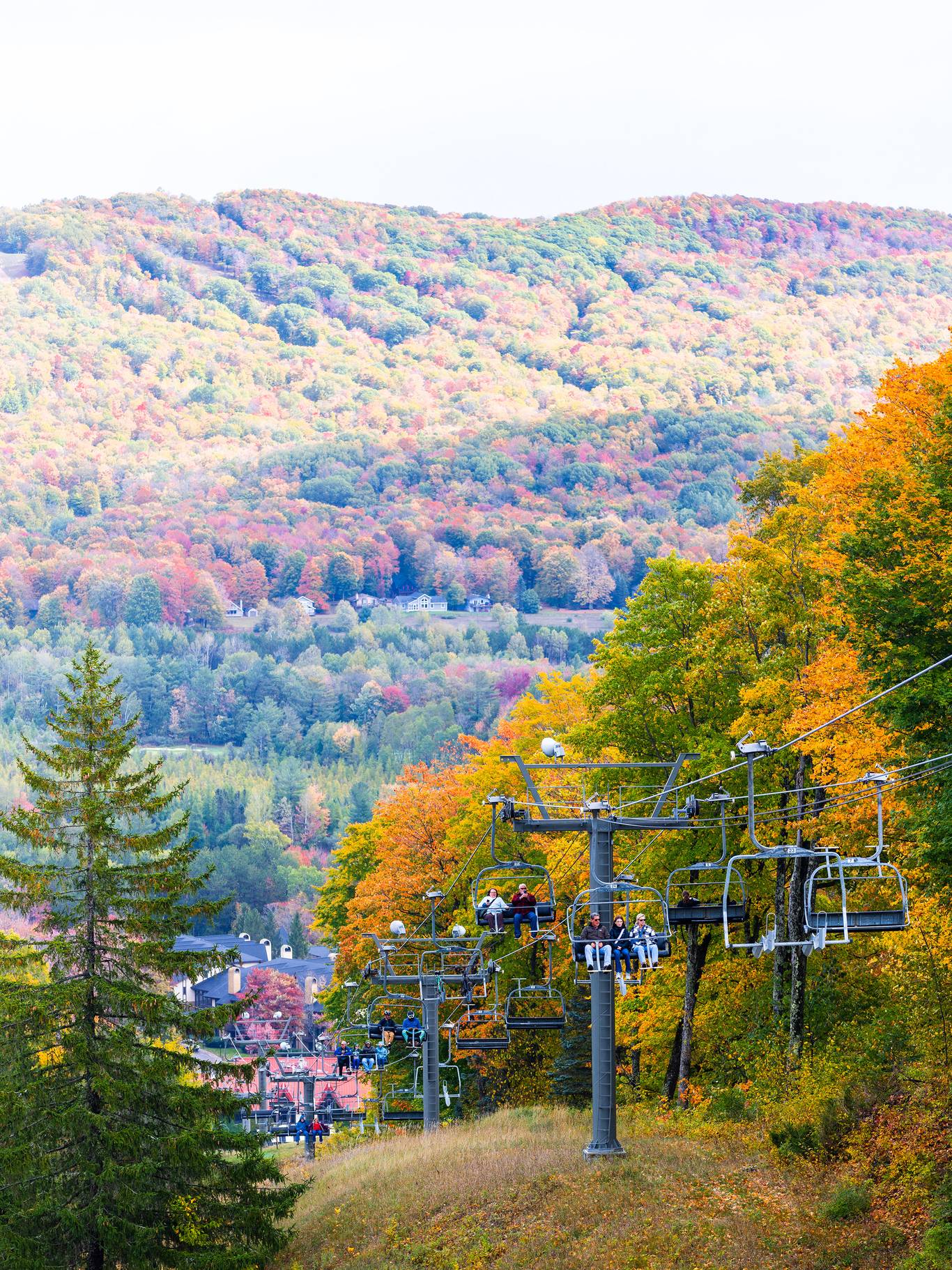 Scenic chairlift riders during fall at The Highlands