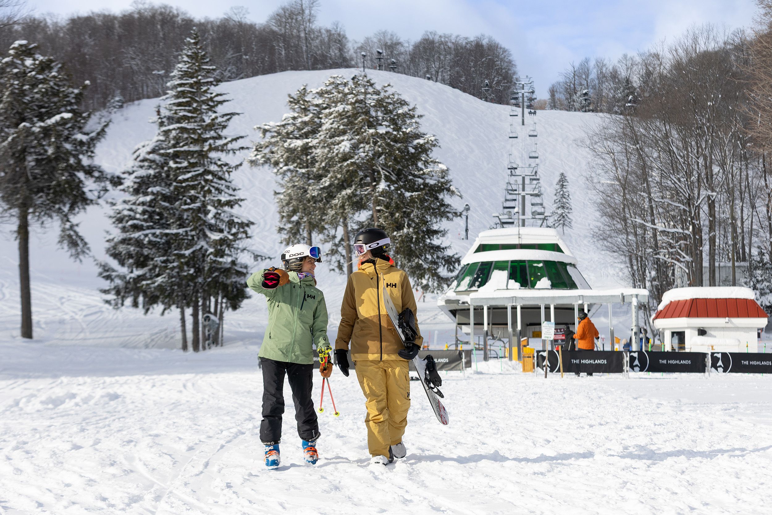Two women walking from the Heather chairlift