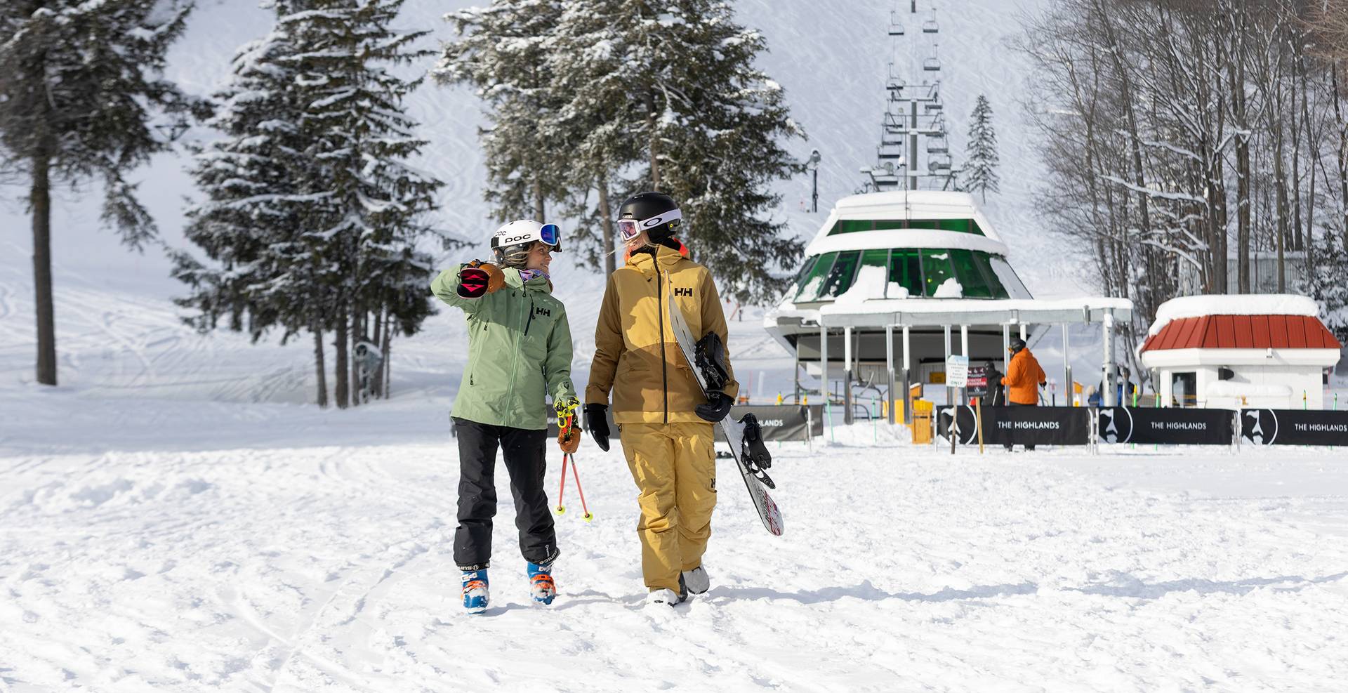 Two women walking from the Heather chairlift