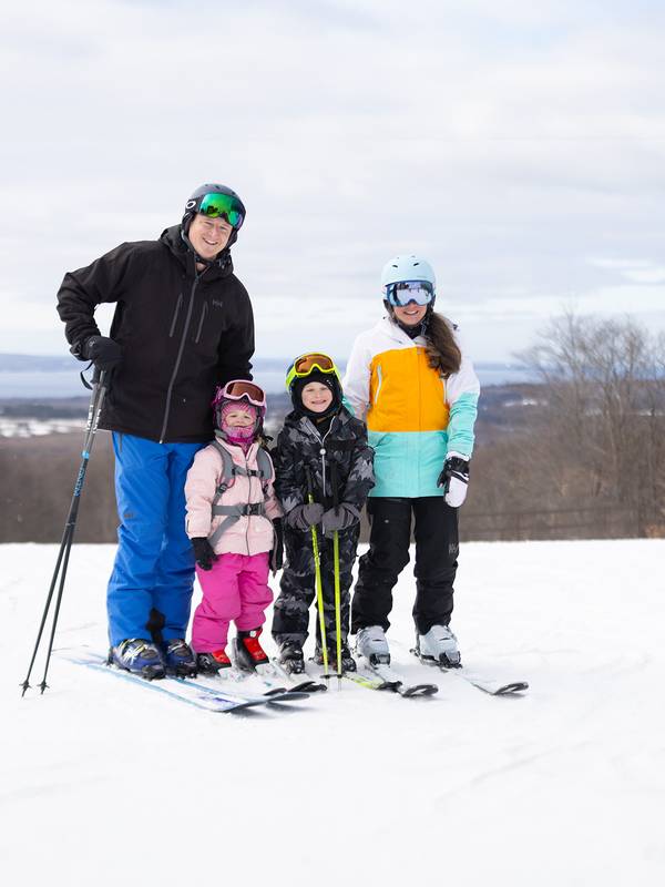 A family in ski gear posing